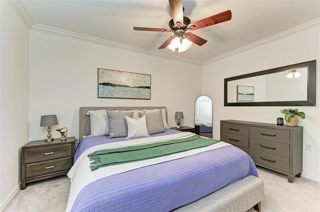 17902 Gawthrop Drive, Unit 307 Lakewood Ranch, FL 34211 - Photo 24 of 74 a bedroom with a bed and a dresser