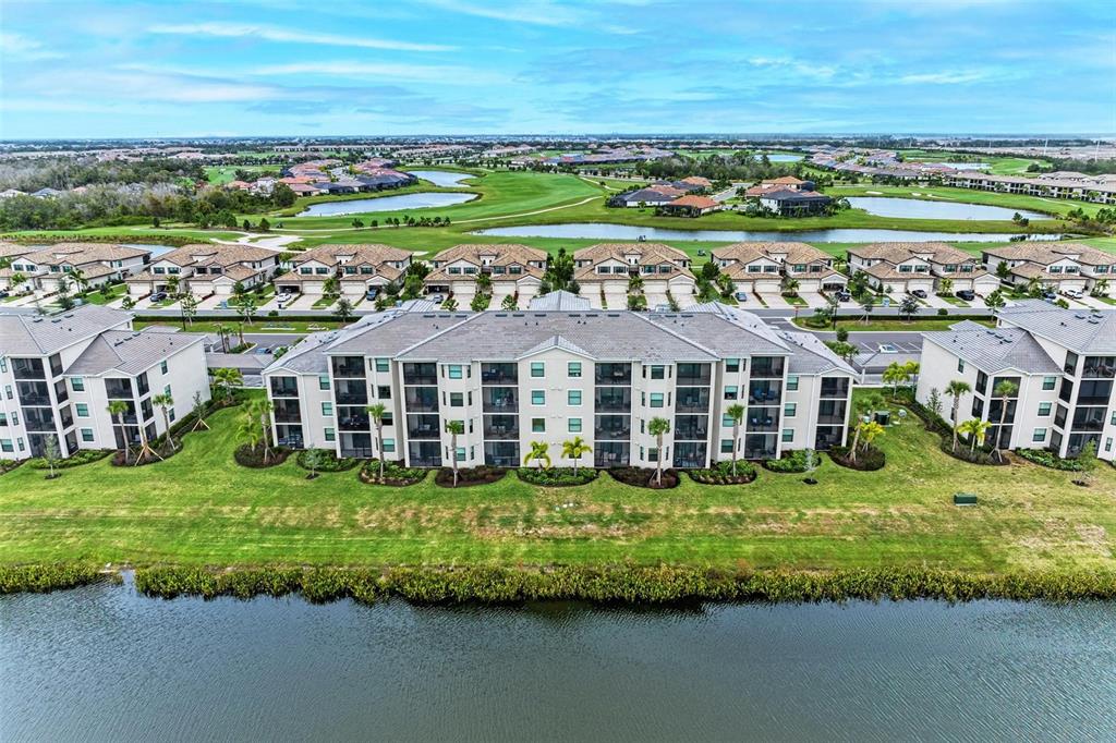 17902 Gawthrop Drive, Unit 307 Lakewood Ranch, FL 34211 - Photo 3 of 74 an aerial view of a house with a garden
