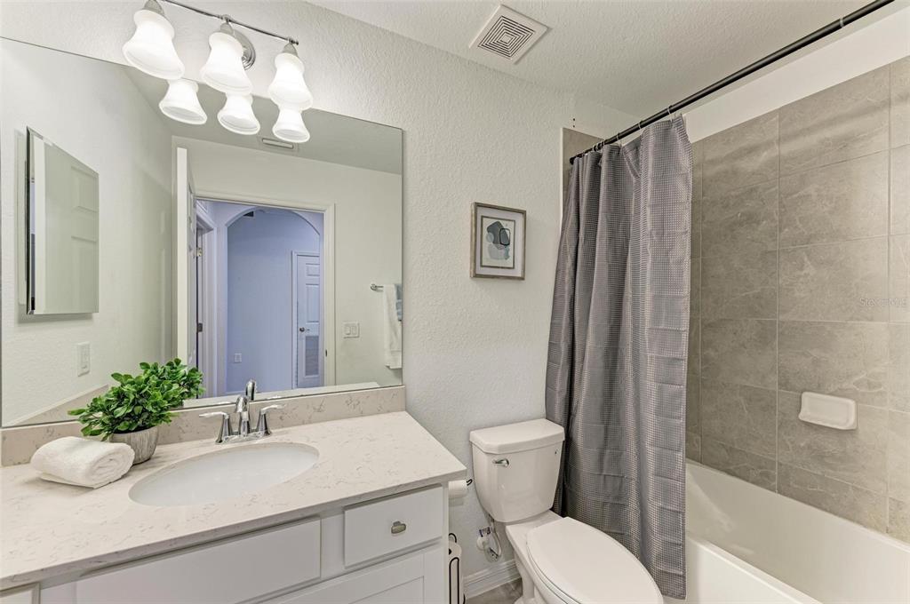 17902 Gawthrop Drive, Unit 307 Lakewood Ranch, FL 34211 - Photo 31 of 74 a bathroom with a sink toilet and shower