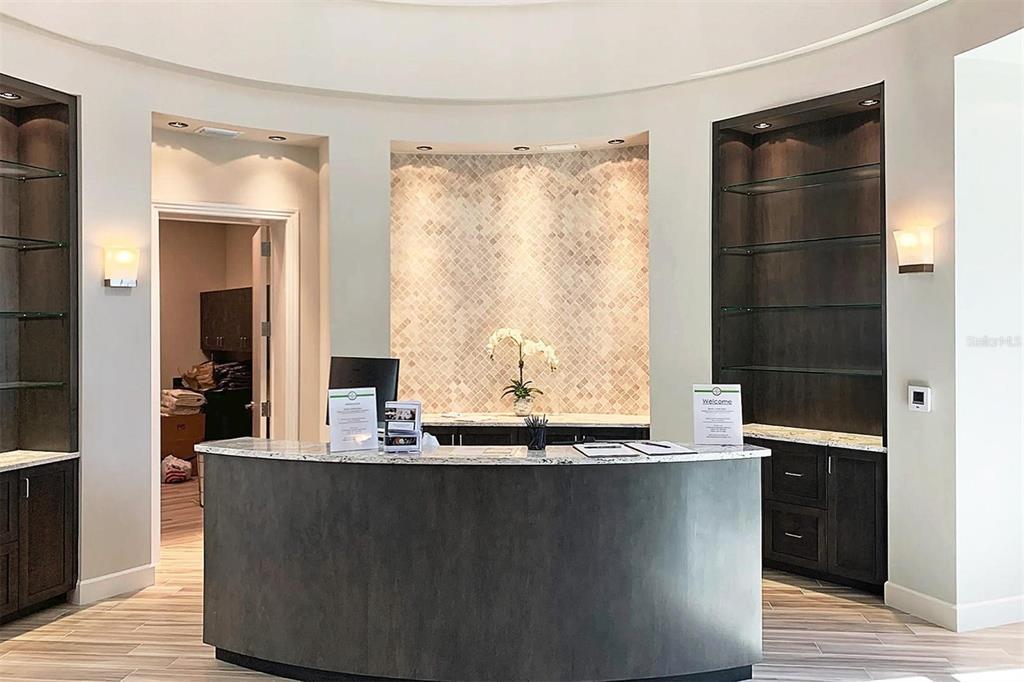 17902 Gawthrop Drive, Unit 307 Lakewood Ranch, FL 34211 - Photo 55 of 74 a room with granite countertop a sink and a large mirror