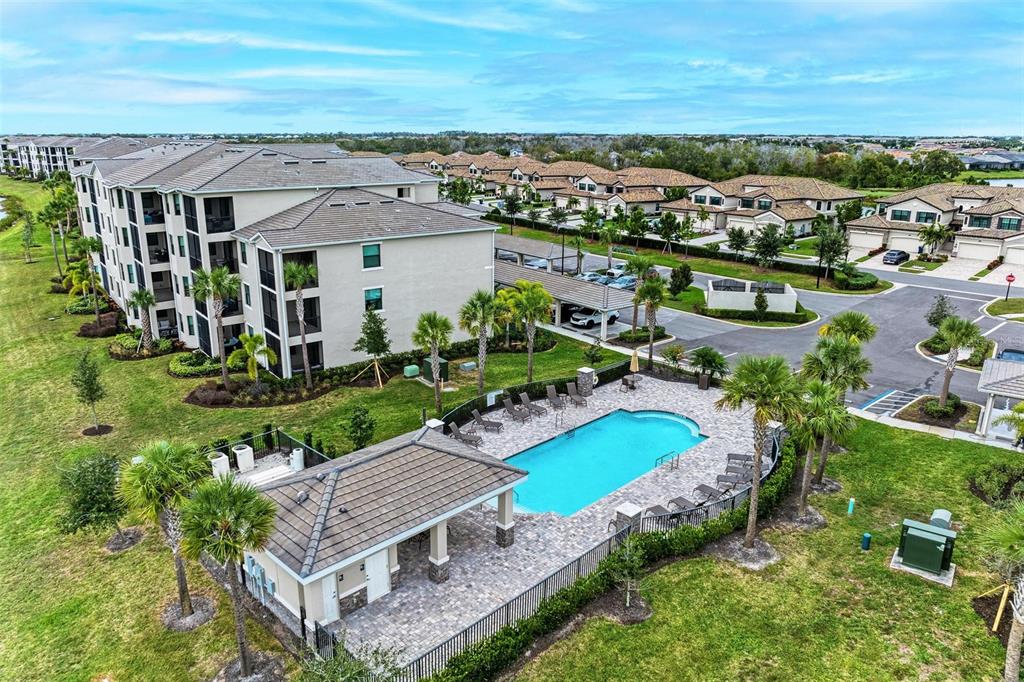 17902 Gawthrop Drive, Unit 307 Lakewood Ranch, FL 34211 - Photo 68 of 74 an aerial view of a house with a garden