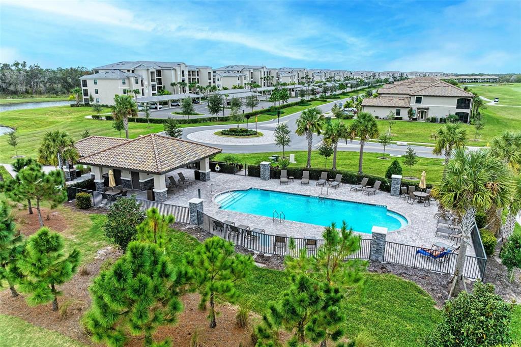 17902 Gawthrop Drive, Unit 307 Lakewood Ranch, FL 34211 - Photo 74 of 74 an aerial view of a house with a garden and lake view