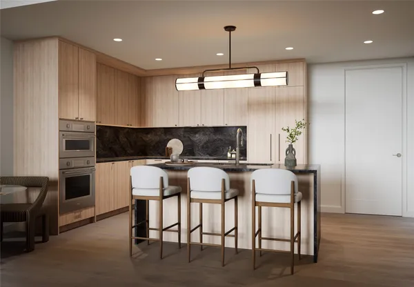 a kitchen with a table chairs stove and microwave