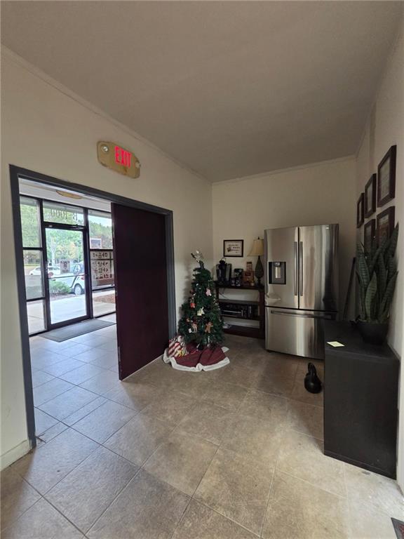 2730 North Berkeley Lake Road Northwest, Unit B1000 Duluth, GA 30096 - Photo 7 of 15 a living room with furniture gym equipment and a large window