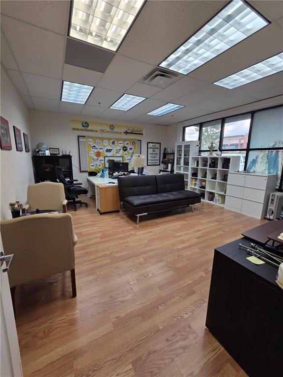 2730 North Berkeley Lake Road Northwest, Unit B1000 Duluth, GA 30096 - Photo 8 of 15 a living room with furniture and a flat screen tv