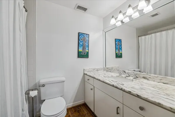 a kitchen with stainless steel appliances kitchen island granite countertop a refrigerator and a stove