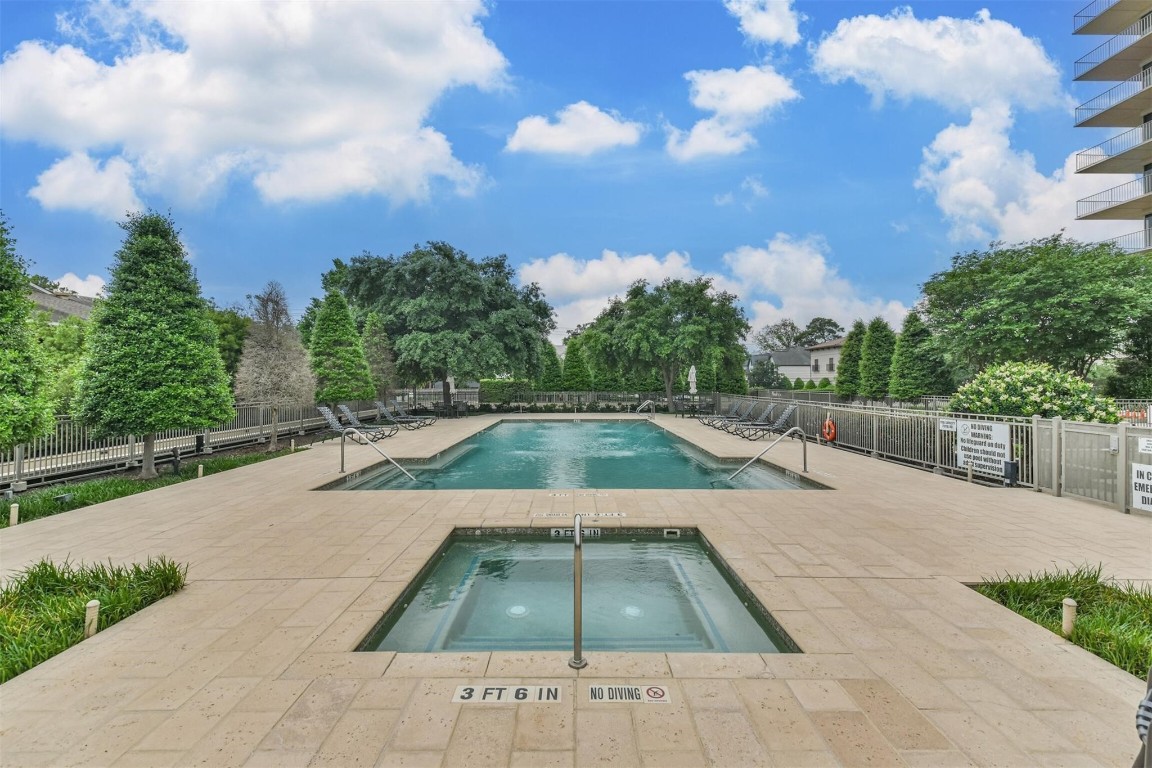 2200 Willowick Road, Unit 4D Houston, TX 77027 - Photo 30 of 36 a view of a swimming pool with a yard