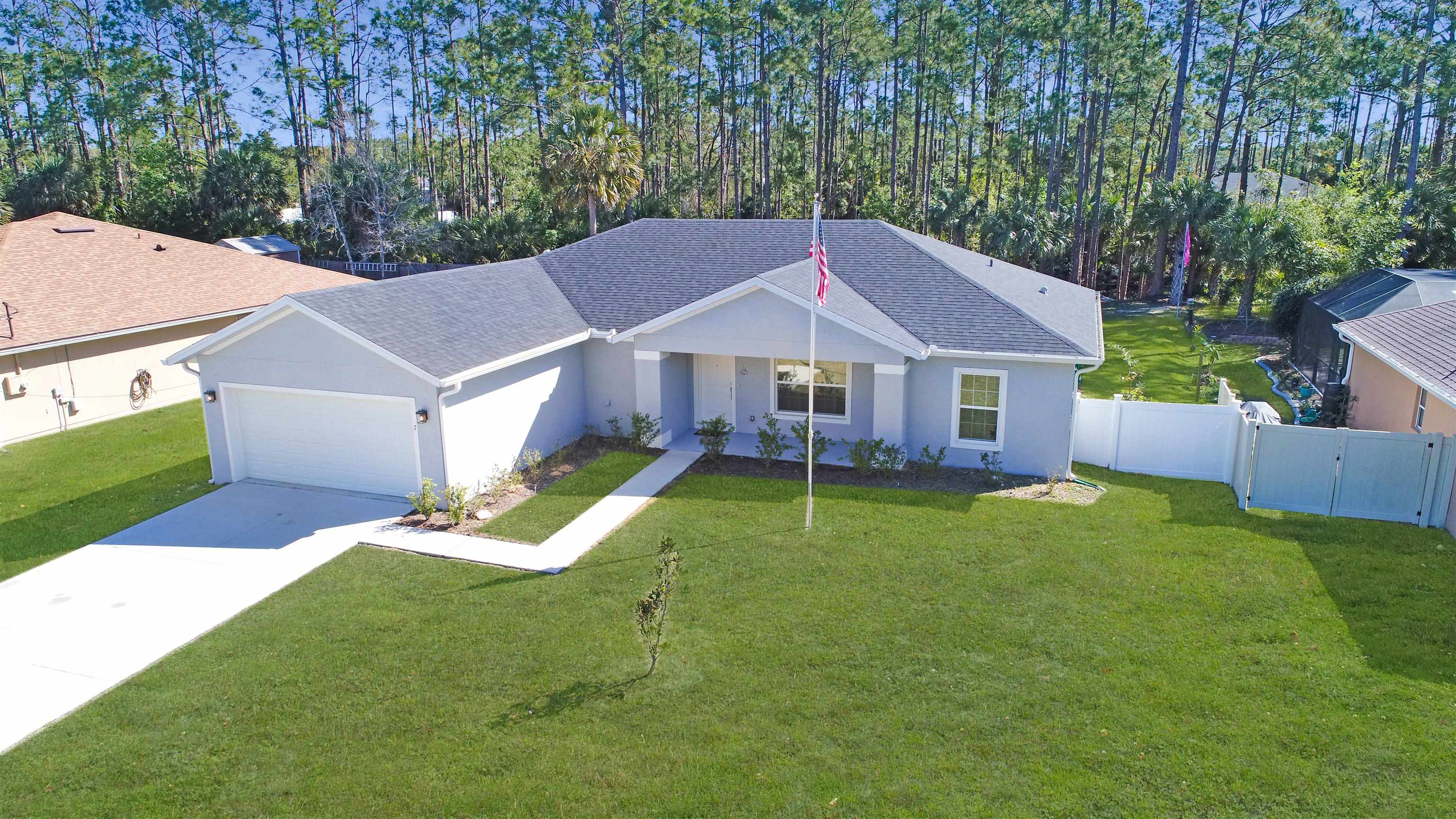 7 Smith Trail Palm Coast, FL 32164 - Photo 1 of 48 a view of a house with a backyard