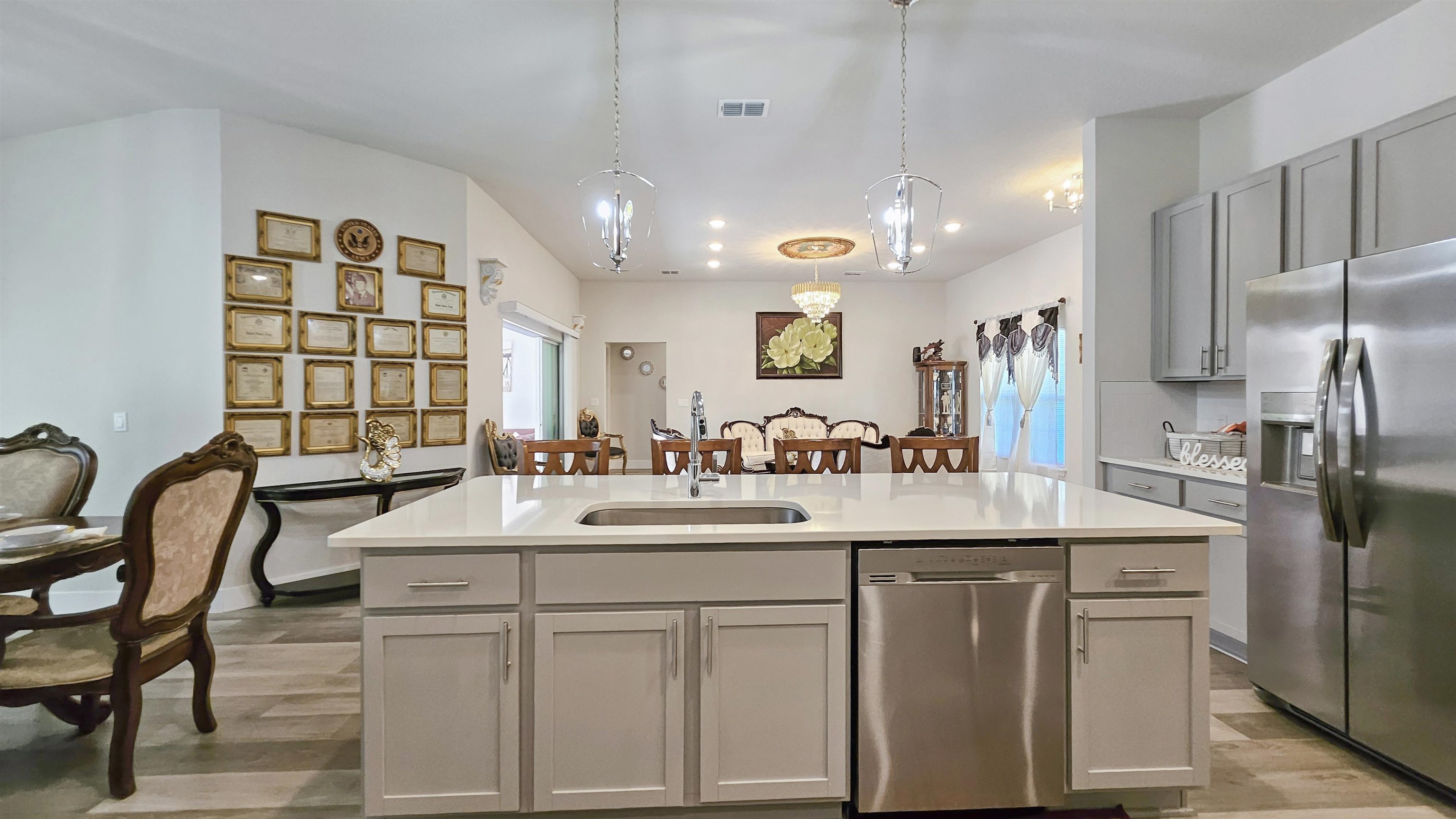 7 Smith Trail Palm Coast, FL 32164 - Photo 13 of 48 a kitchen with kitchen island granite countertop a sink and refrigerator