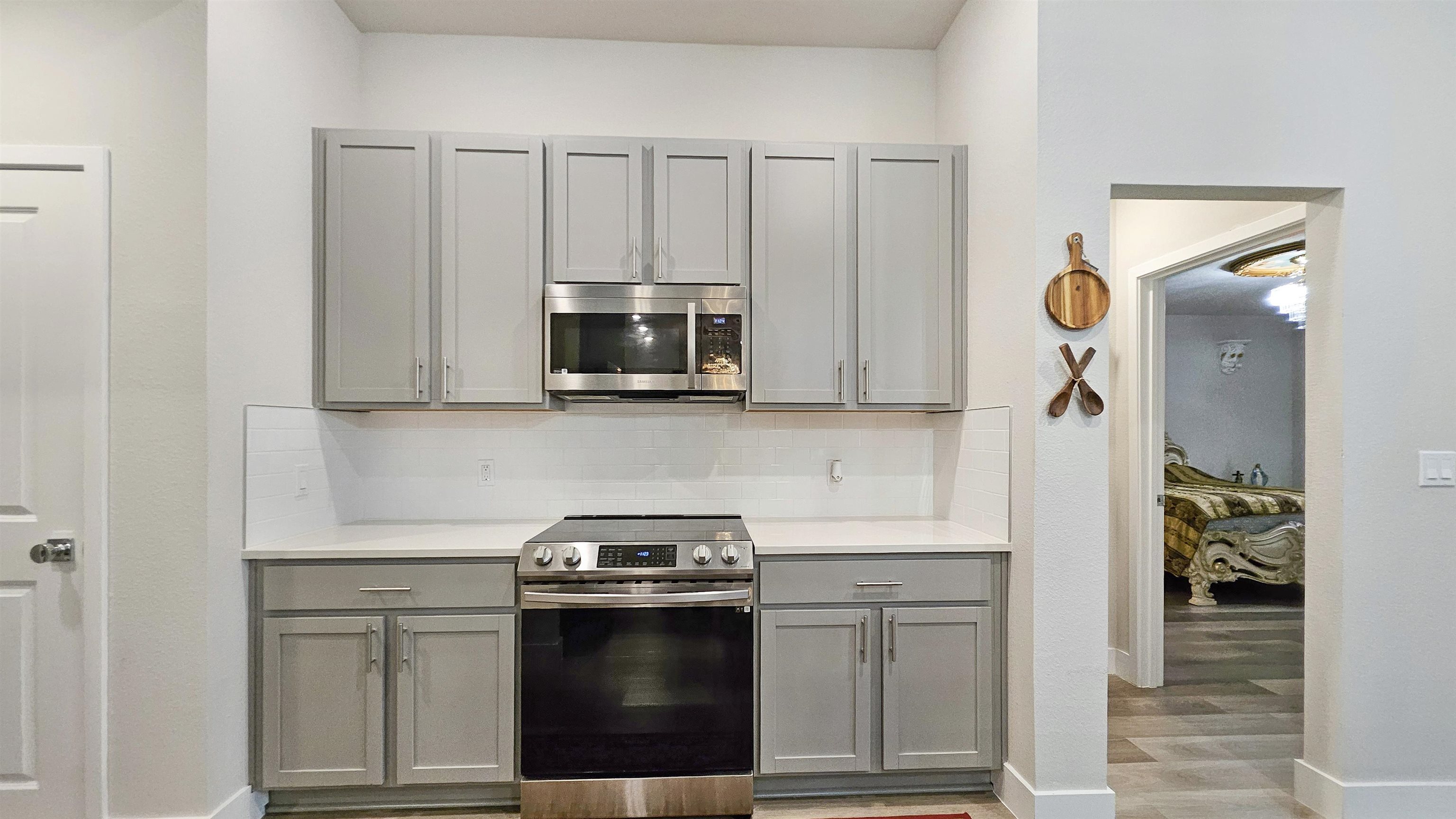 7 Smith Trail Palm Coast, FL 32164 - Photo 15 of 48 a kitchen with stainless steel appliances granite countertop a sink stove and microwave