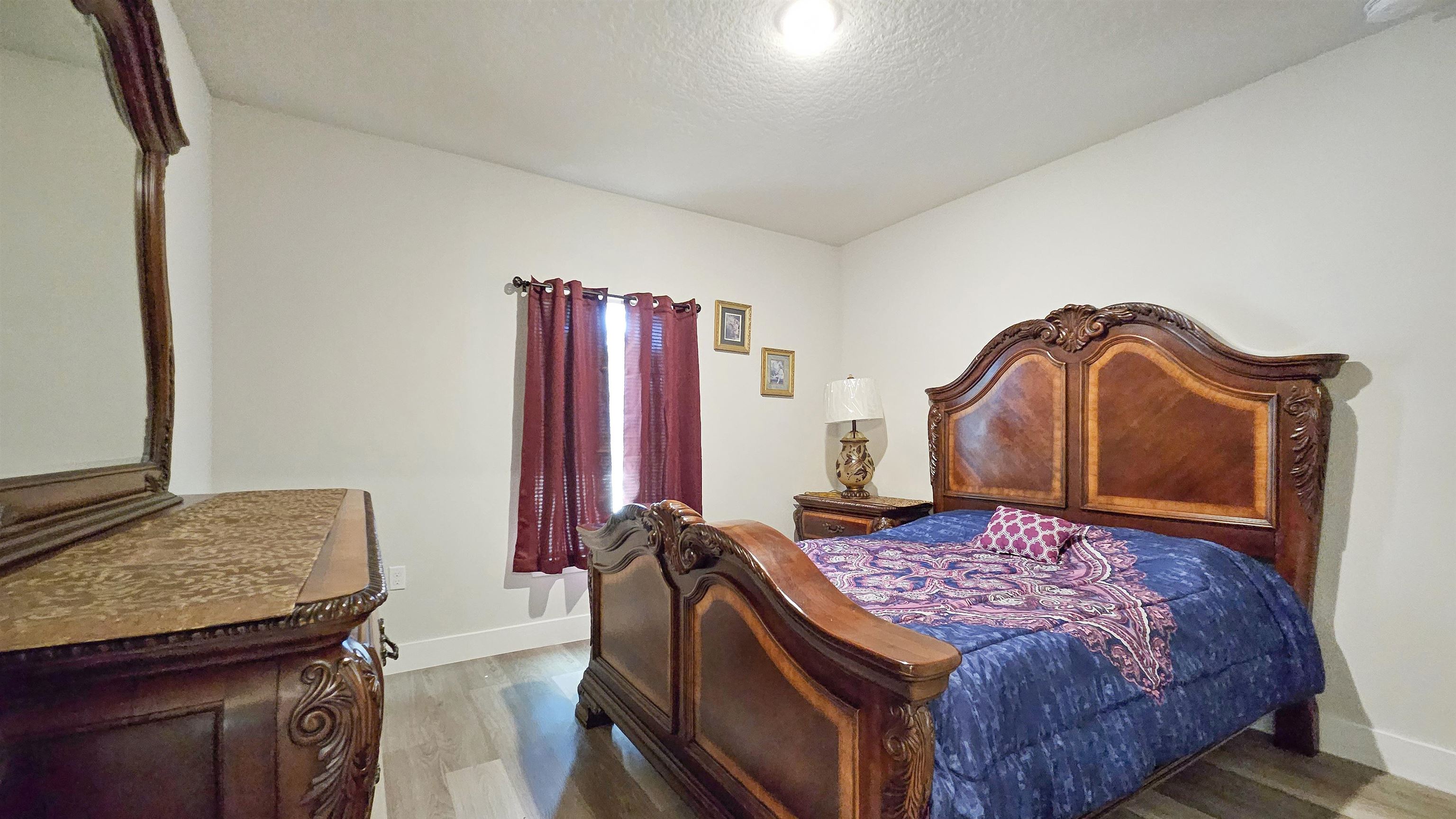 7 Smith Trail Palm Coast, FL 32164 - Photo 25 of 48 a bedroom with a bed and dresser