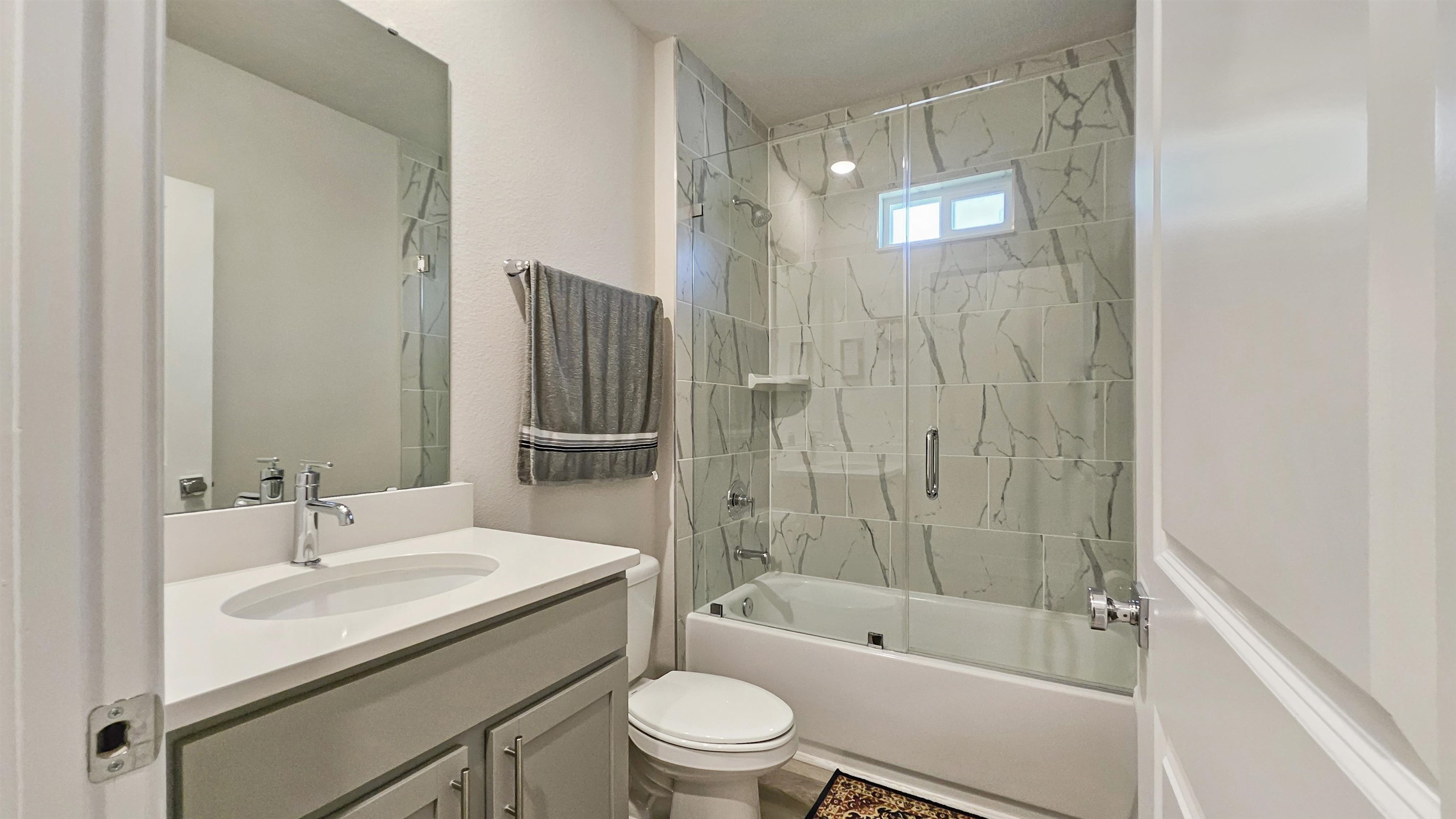 7 Smith Trail Palm Coast, FL 32164 - Photo 26 of 48 a bathroom with a granite countertop sink a toilet and shower