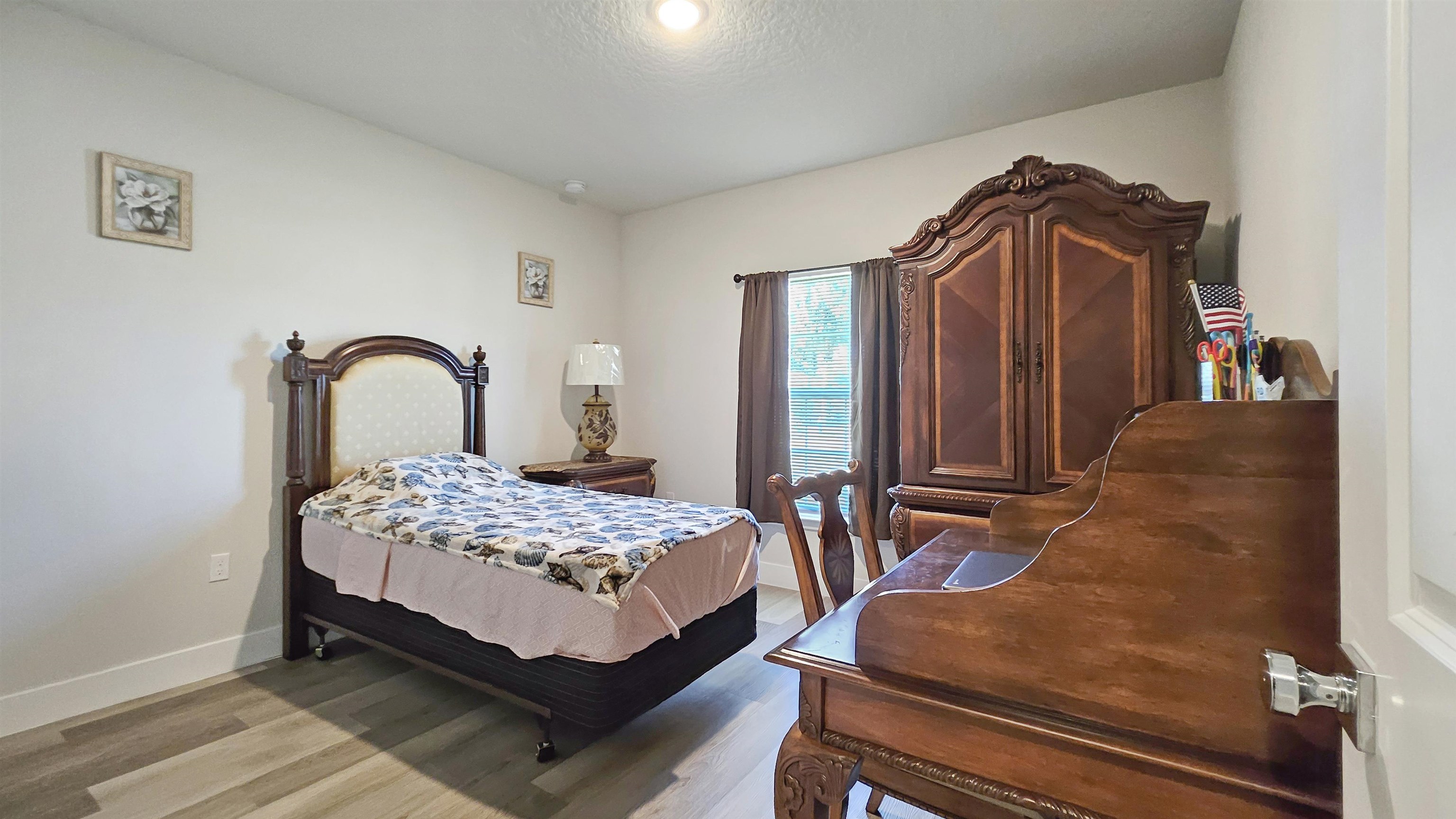 7 Smith Trail Palm Coast, FL 32164 - Photo 27 of 48 a bedroom with bed and a dresser