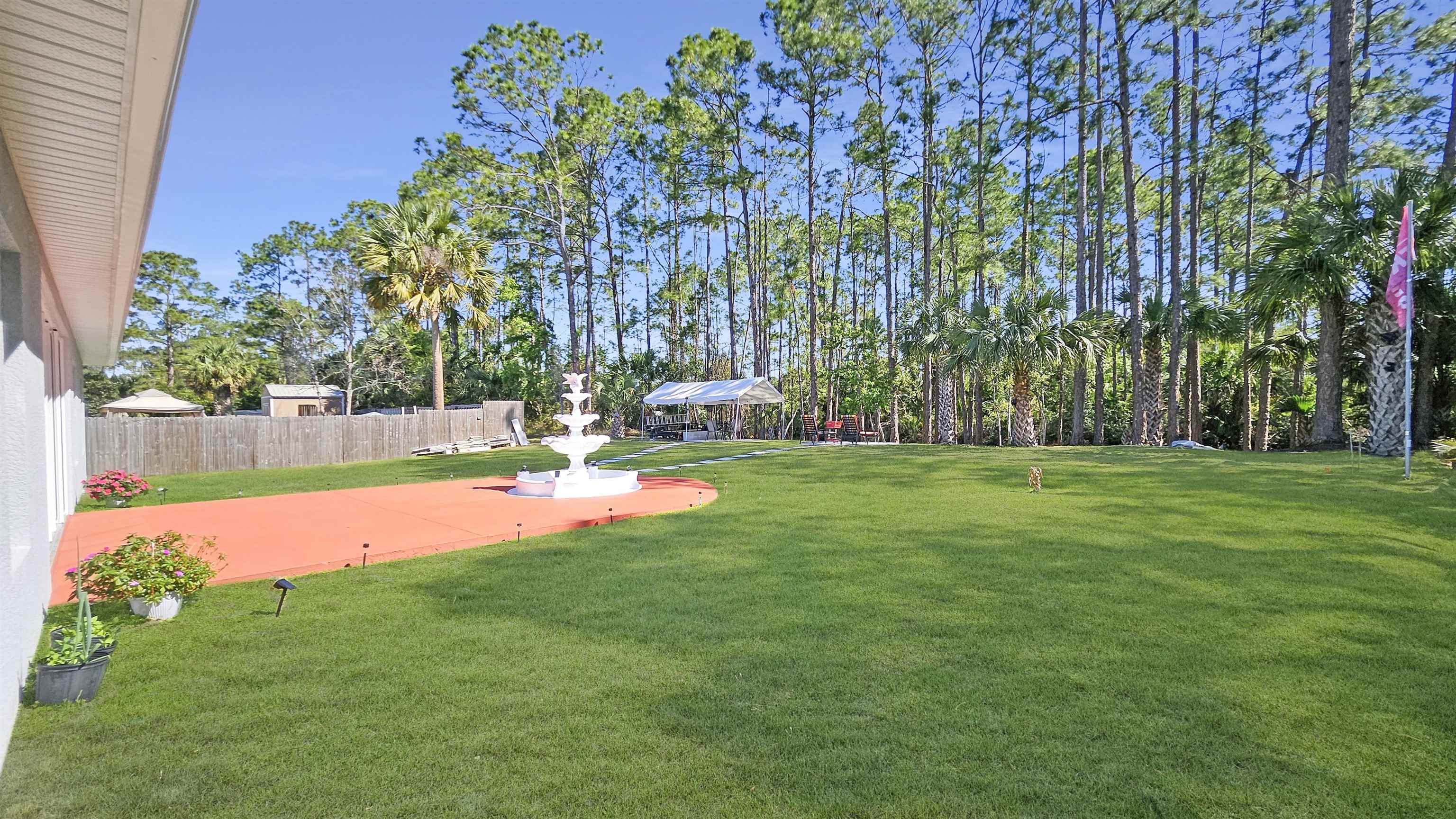 7 Smith Trail Palm Coast, FL 32164 - Photo 37 of 48 a view of yard with swimming pool and green space