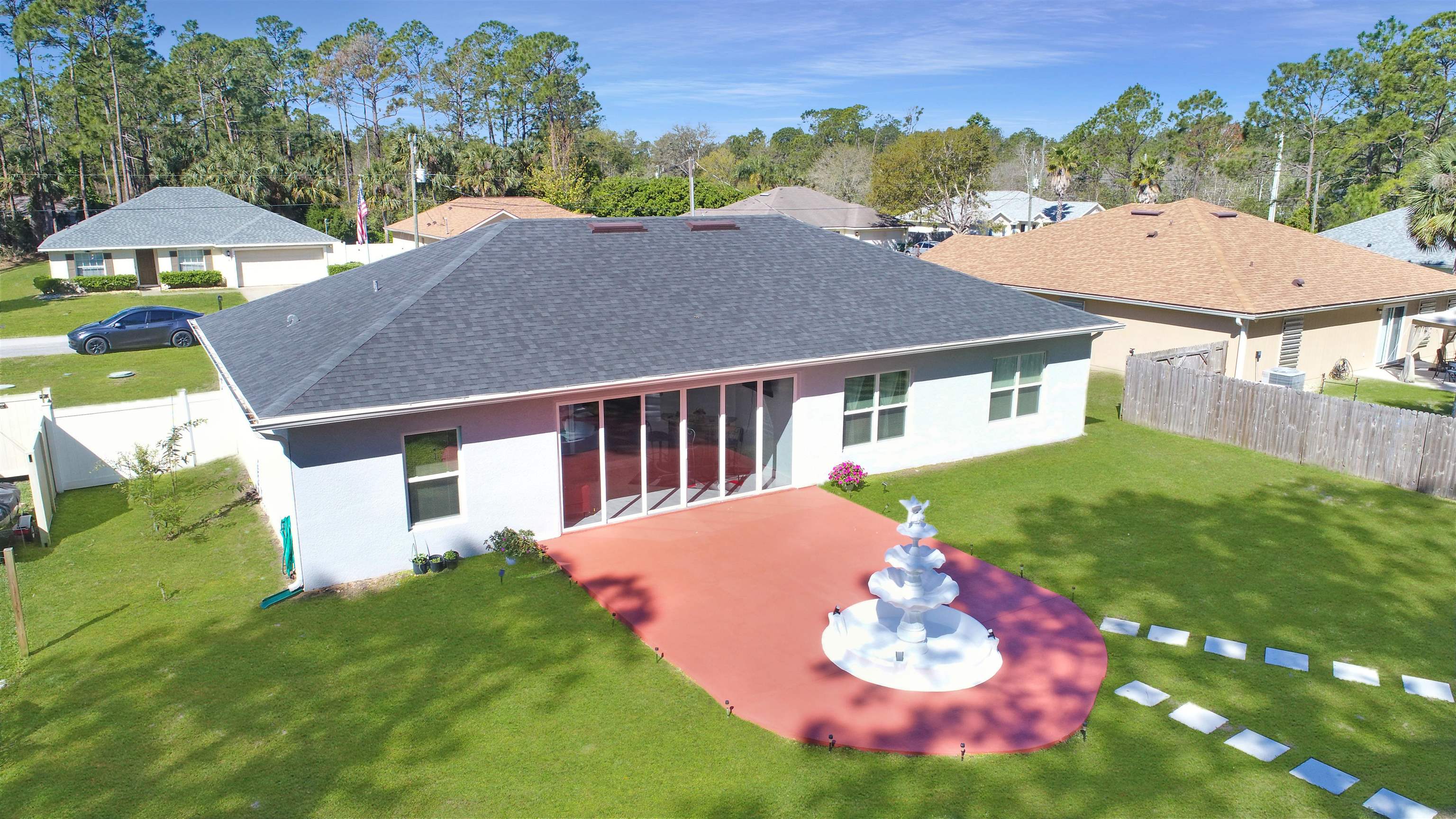 7 Smith Trail Palm Coast, FL 32164 - Photo 38 of 48 a front view of a house with a yard and garage