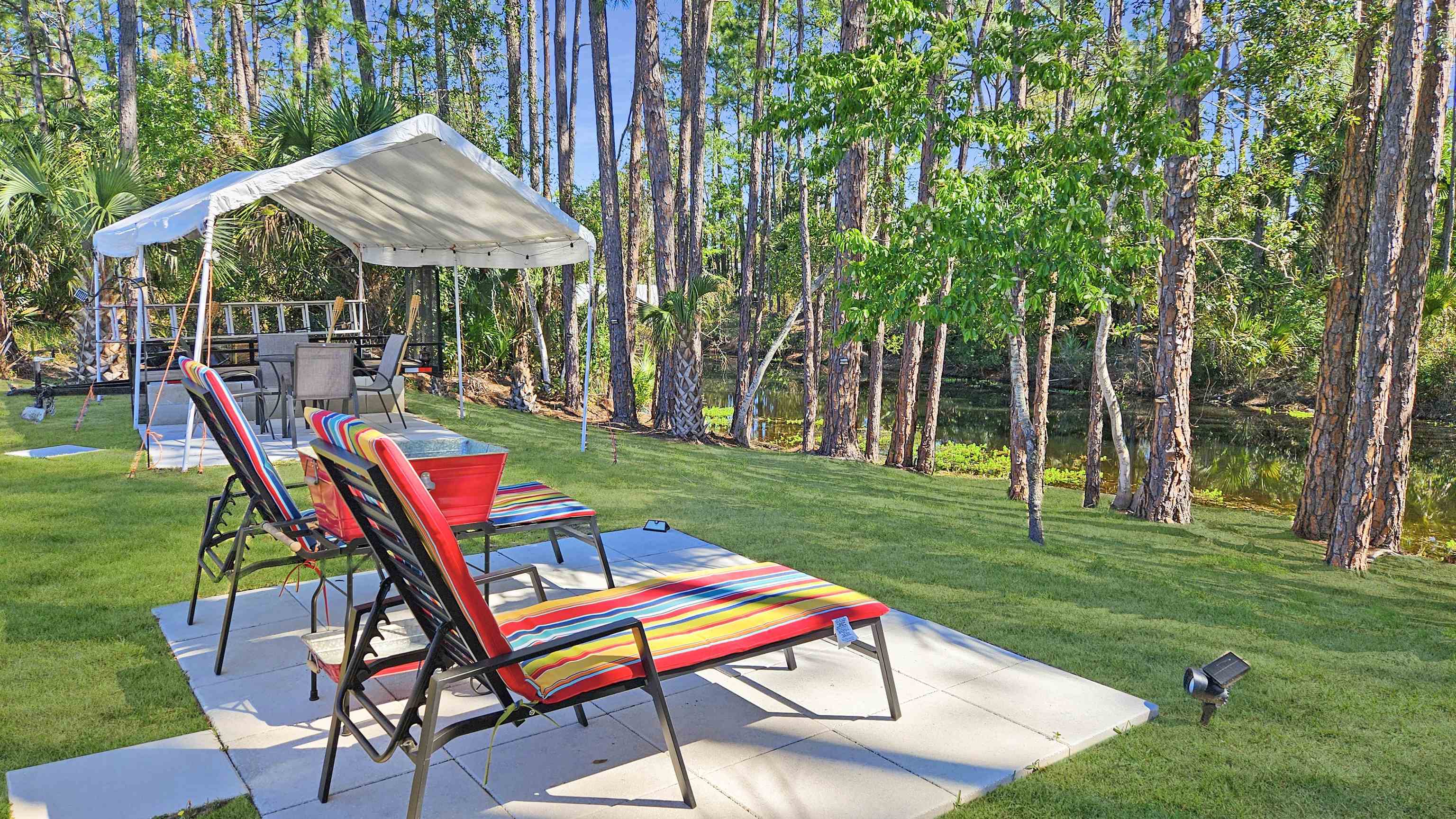 7 Smith Trail Palm Coast, FL 32164 - Photo 40 of 48 a view of backyard with a slide and table