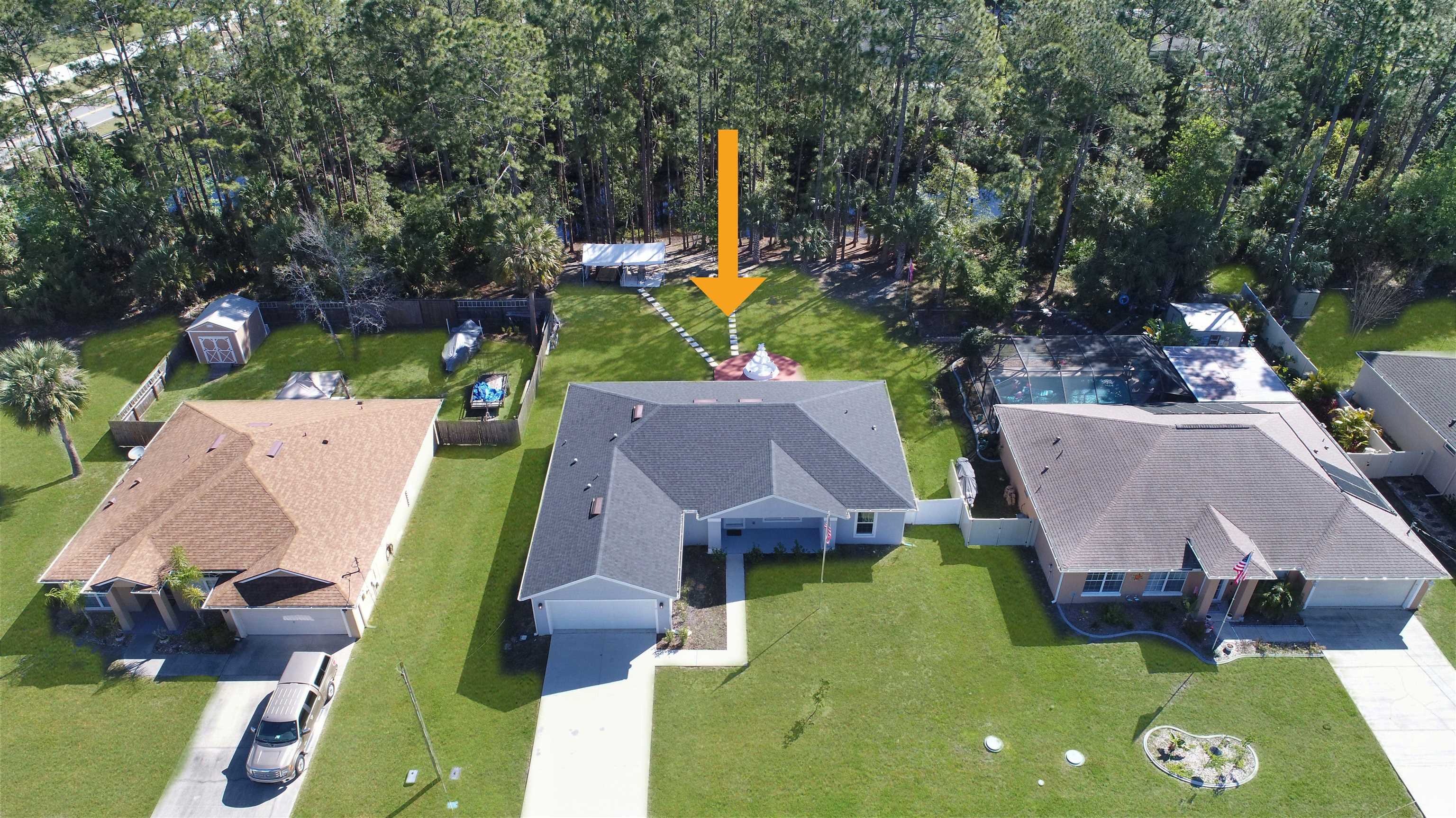 7 Smith Trail Palm Coast, FL 32164 - Photo 47 of 48 an aerial view of a house with swimming pool and big yard