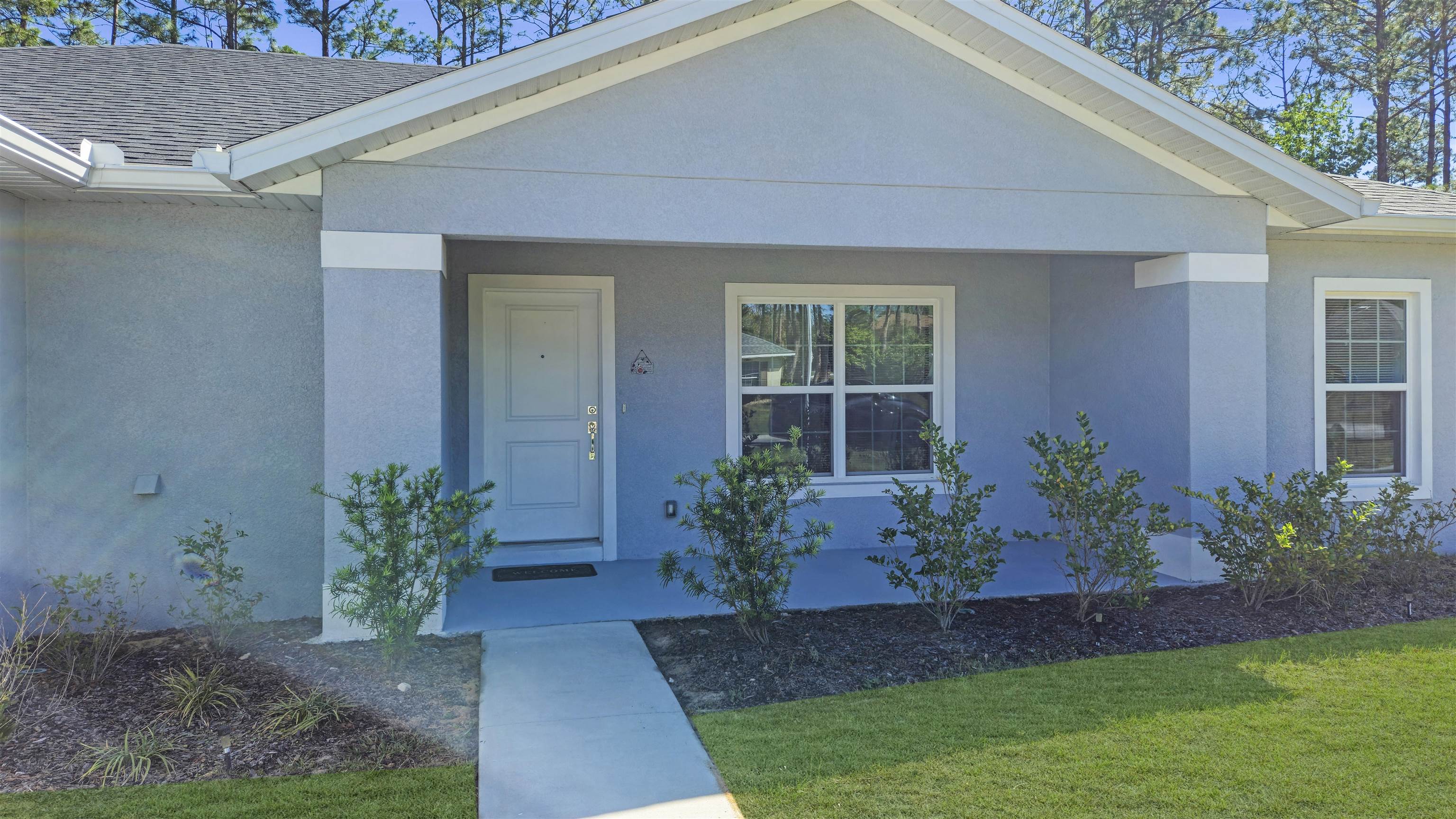 7 Smith Trail Palm Coast, FL 32164 - Photo 7 of 48 a view of a house with a garden