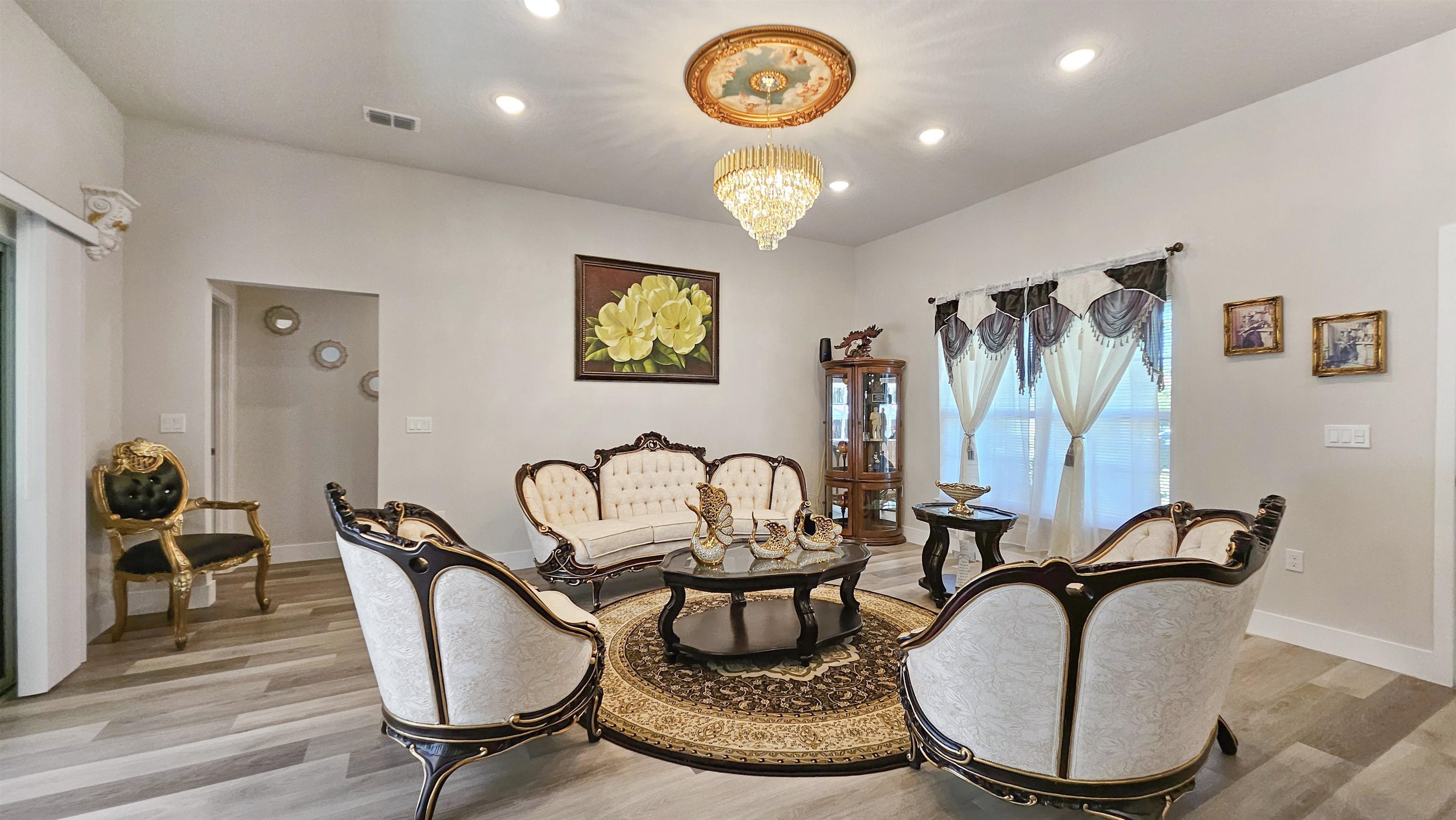 7 Smith Trail Palm Coast, FL 32164 - Photo 8 of 48 a view of a dining room with furniture a chandelier and wooden floor