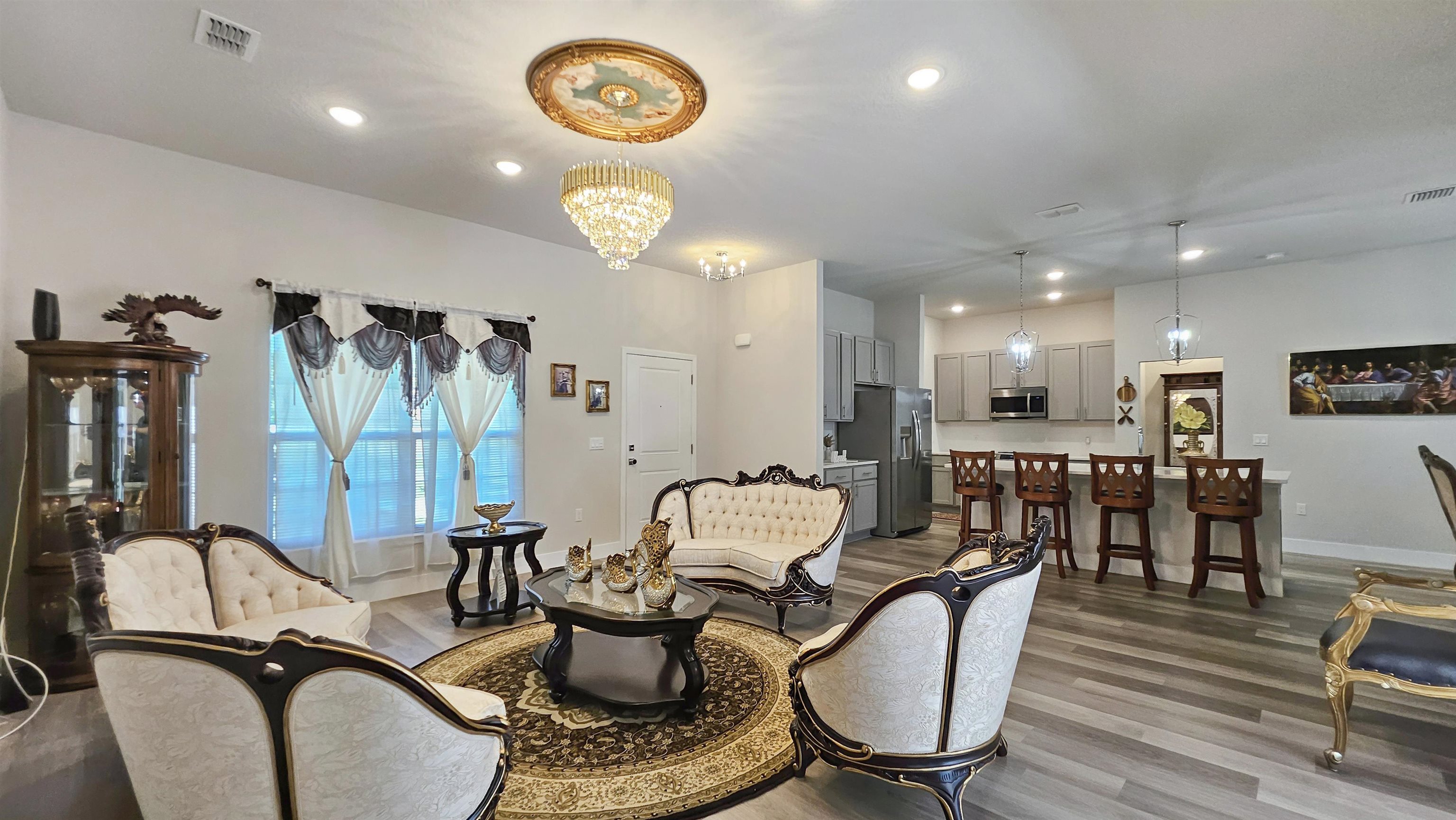 7 Smith Trail Palm Coast, FL 32164 - Photo 9 of 48 a living room with furniture a flat screen tv and kitchen view