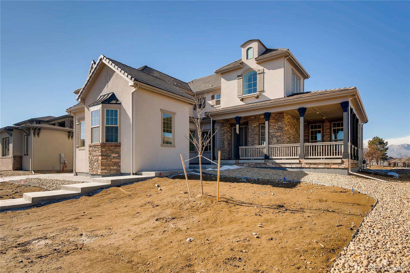 2293 Picadilly Circle Longmont, CO 80503 - Photo 1 of 35 a front view of a house with a yard and garage