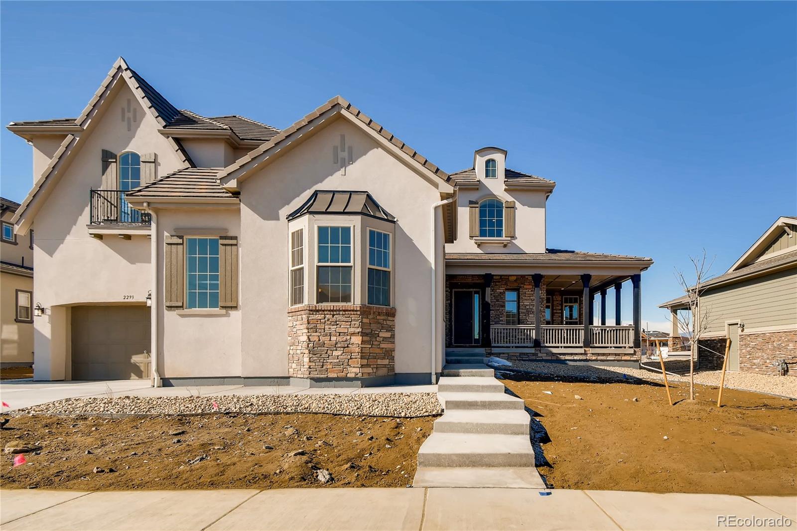 2293 Picadilly Circle Longmont, CO 80503 - Photo 2 of 35 a front view of a house with a porch