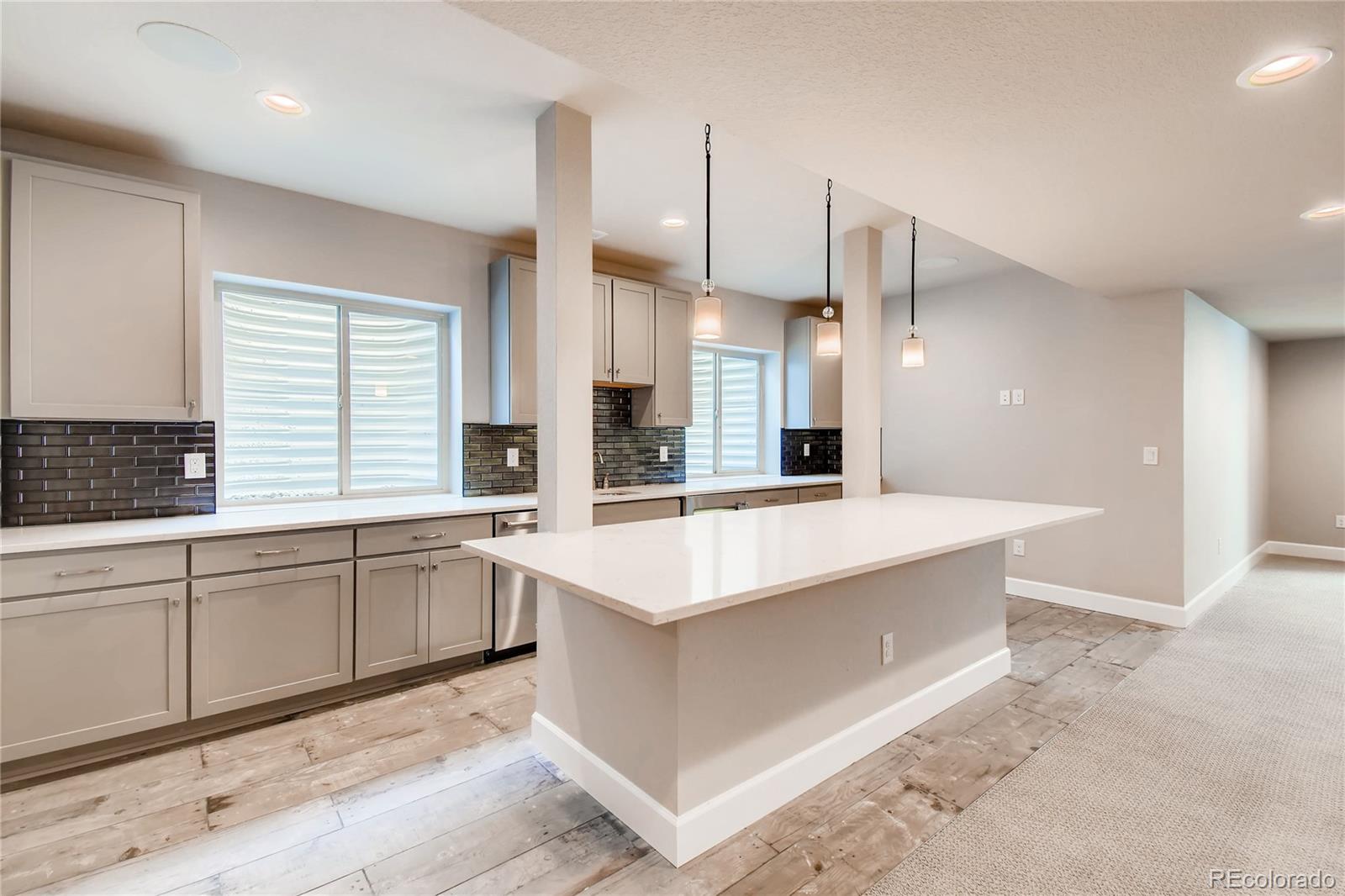 2293 Picadilly Circle Longmont, CO 80503 - Photo 29 of 35 a large white kitchen with a large window