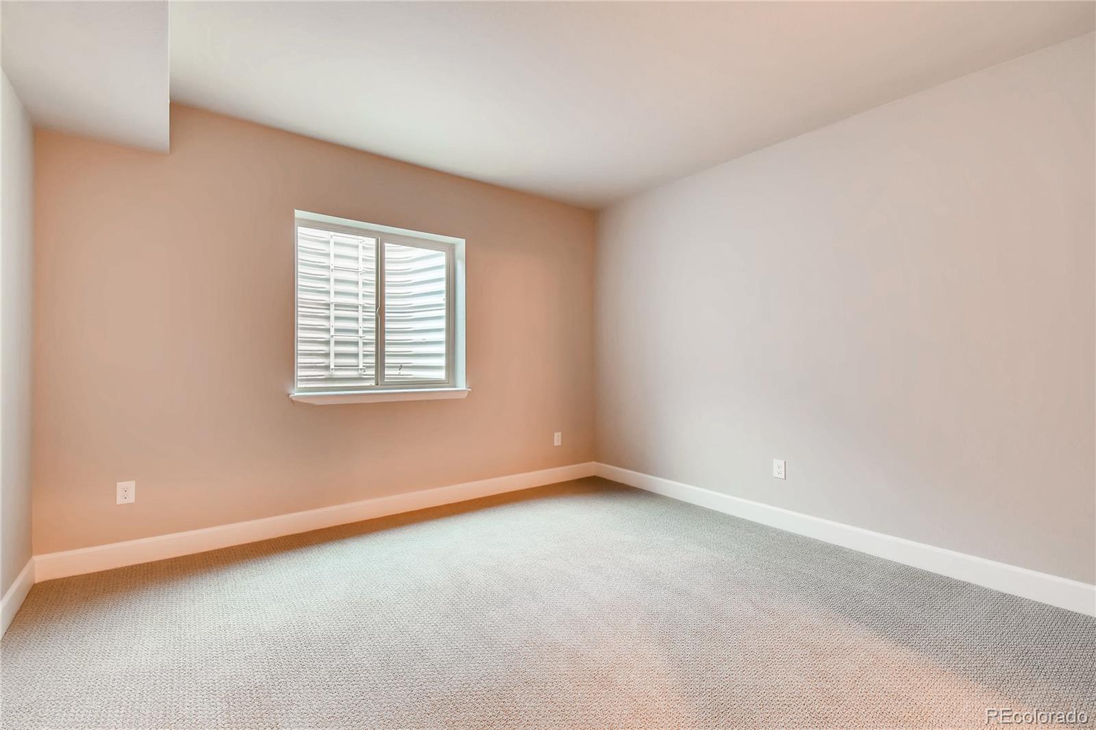 2293 Picadilly Circle Longmont, CO 80503 - Photo 31 of 35 an empty room with a window