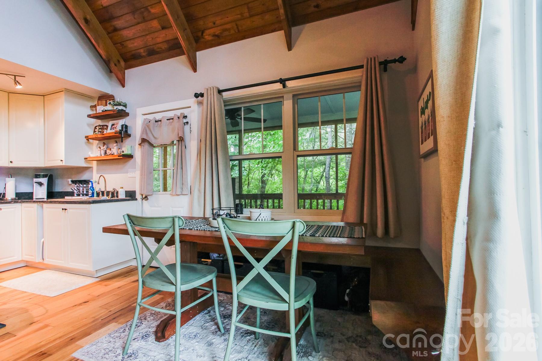292 Wolf Creek Heights Road Almond, NC 28702 - Photo 12 of 47 a dining room with furniture and window