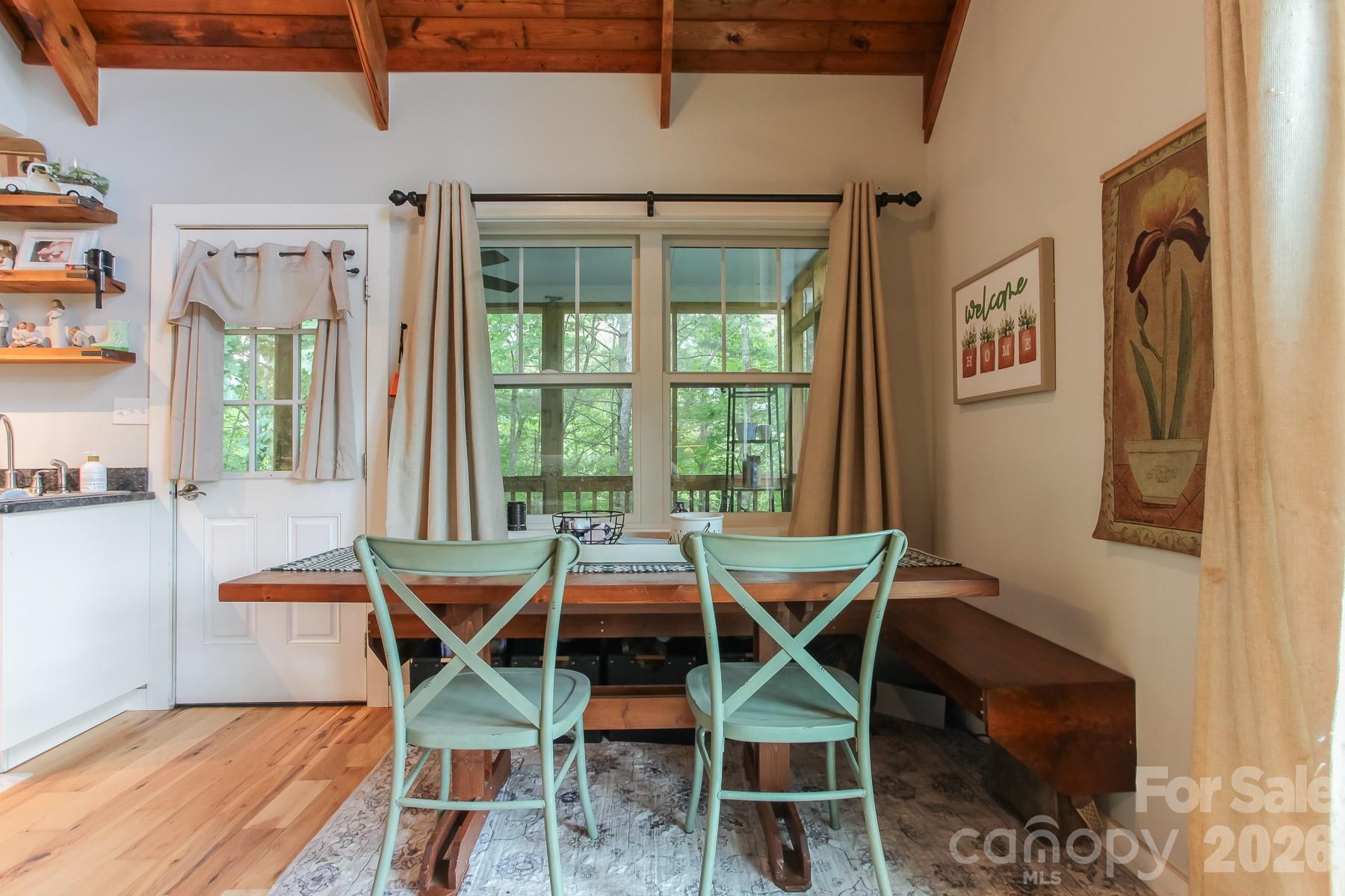 292 Wolf Creek Heights Road Almond, NC 28702 - Photo 13 of 47 a view of a dining room with furniture window and outside view