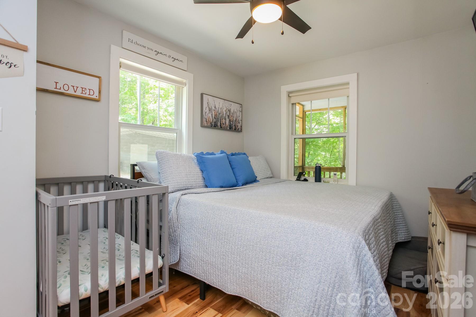 292 Wolf Creek Heights Road Almond, NC 28702 - Photo 23 of 47 a bedroom with a bed and a window
