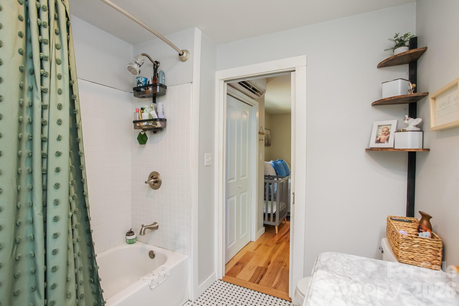 292 Wolf Creek Heights Road Almond, NC 28702 - Photo 27 of 47 a bathroom with a bathtub and shower
