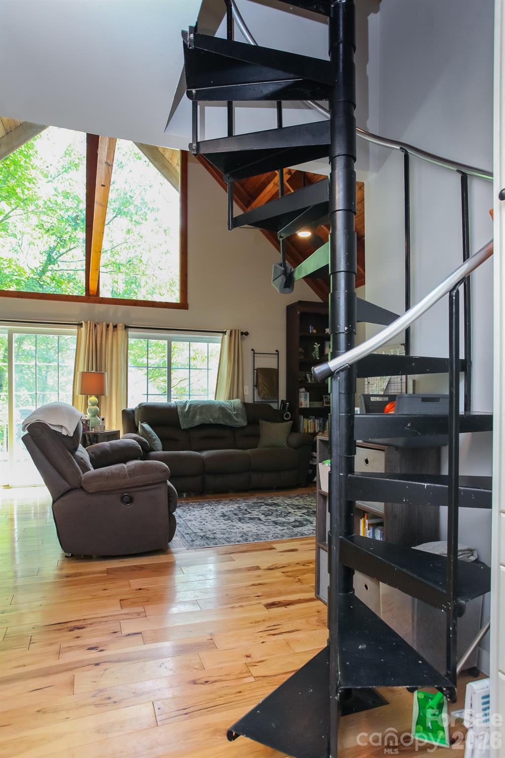 292 Wolf Creek Heights Road Almond, NC 28702 - Photo 29 of 47 a living room with furniture windows and wooden floor