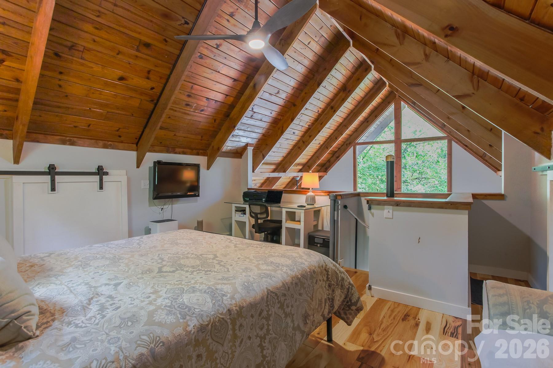 292 Wolf Creek Heights Road Almond, NC 28702 - Photo 31 of 47 a bedroom with a large bed and a window