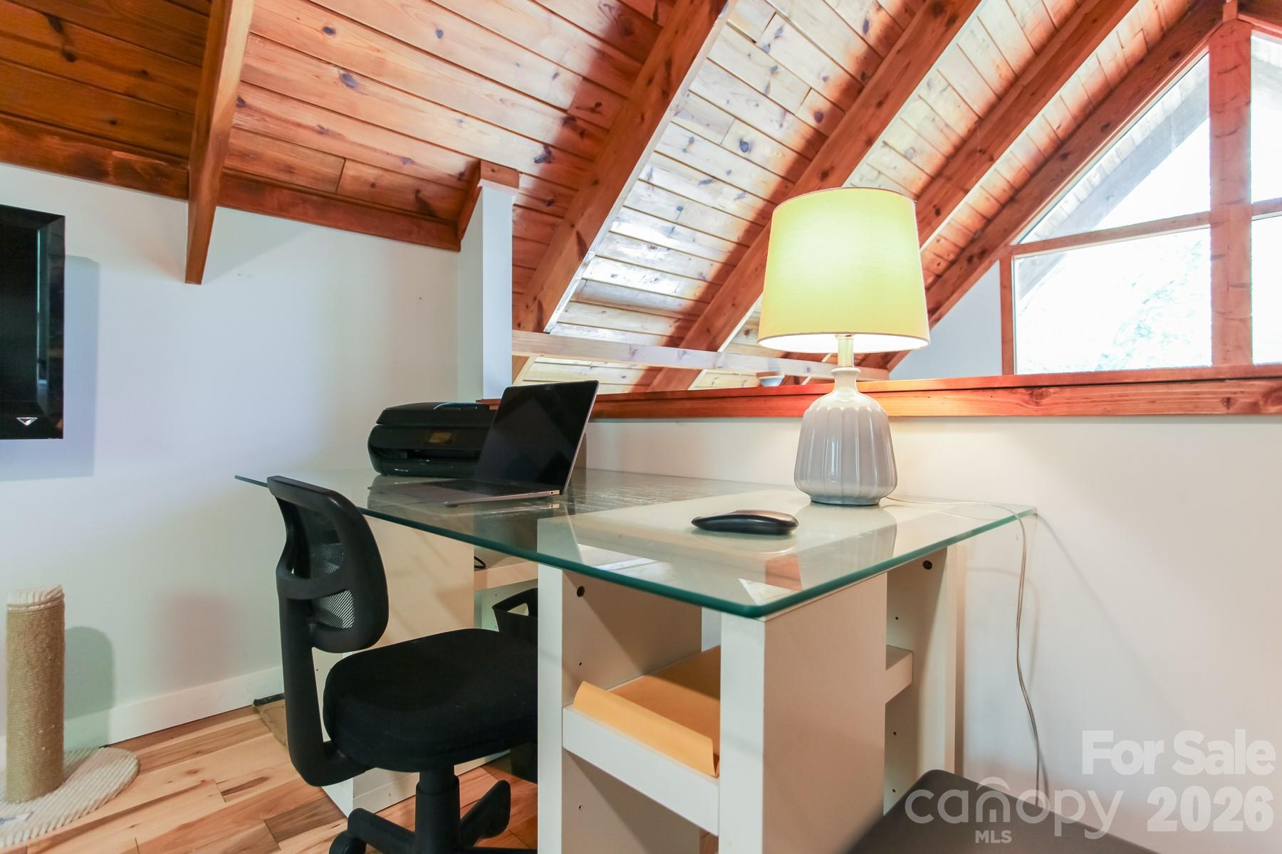 292 Wolf Creek Heights Road Almond, NC 28702 - Photo 34 of 47 a view of a workspace with furniture and a window