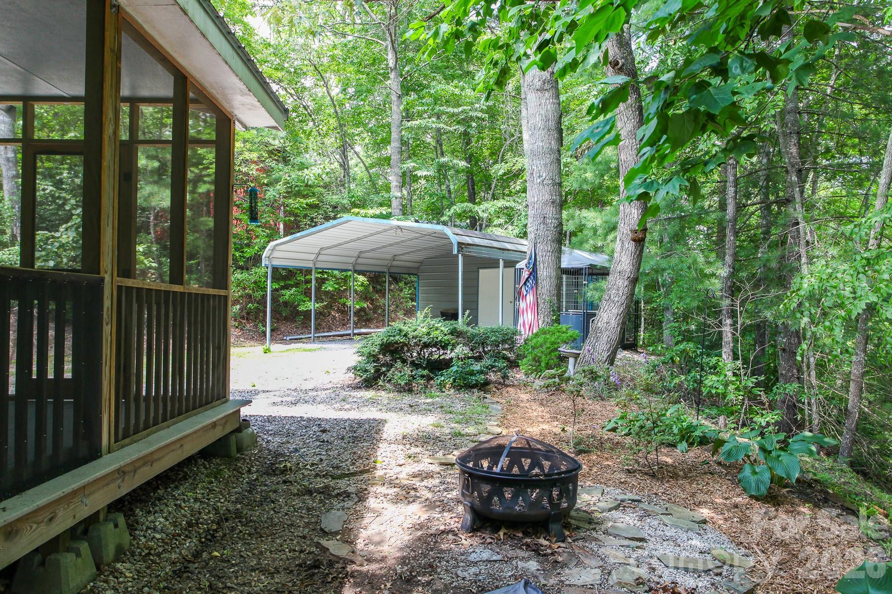 292 Wolf Creek Heights Road Almond, NC 28702 - Photo 39 of 47 a view of a house with backyard and sitting area