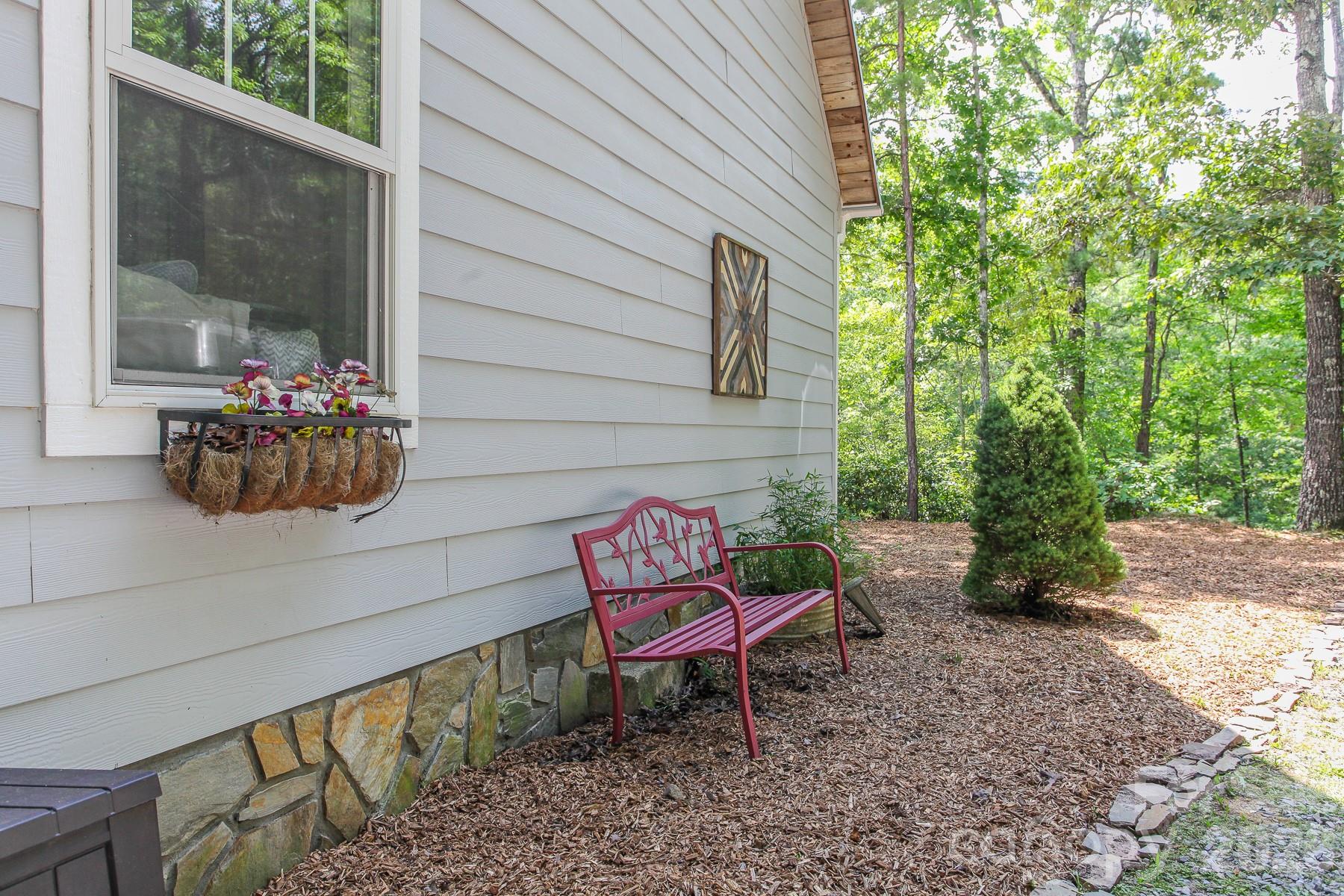 292 Wolf Creek Heights Road Almond, NC 28702 - Photo 40 of 47 a backyard of a house with outdoor seating