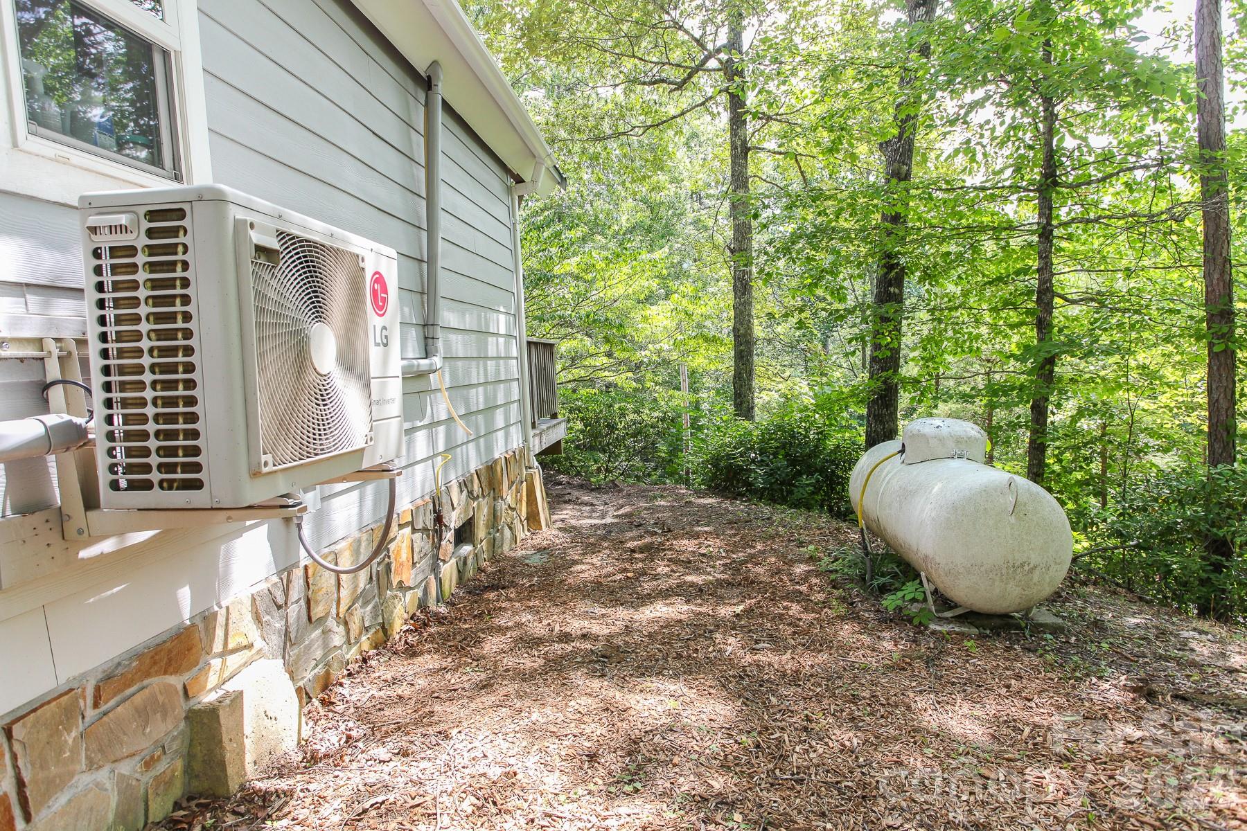292 Wolf Creek Heights Road Almond, NC 28702 - Photo 42 of 47 a backyard of a house with table and chairs