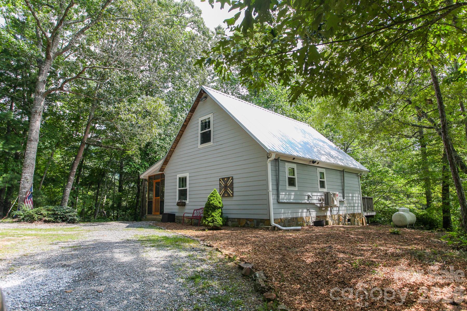 292 Wolf Creek Heights Road Almond, NC 28702 - Photo 43 of 47 a view of a house with backyard and trees