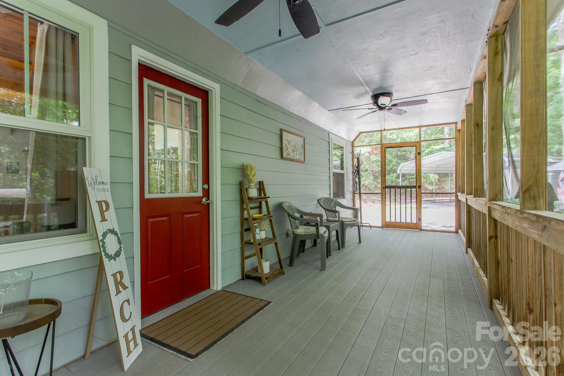 292 Wolf Creek Heights Road Almond, NC 28702 - Photo 10 of 47 a view of a livingroom with furniture and a ceiling fan