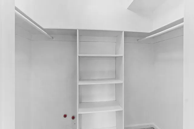 a view of an empty walk in closet