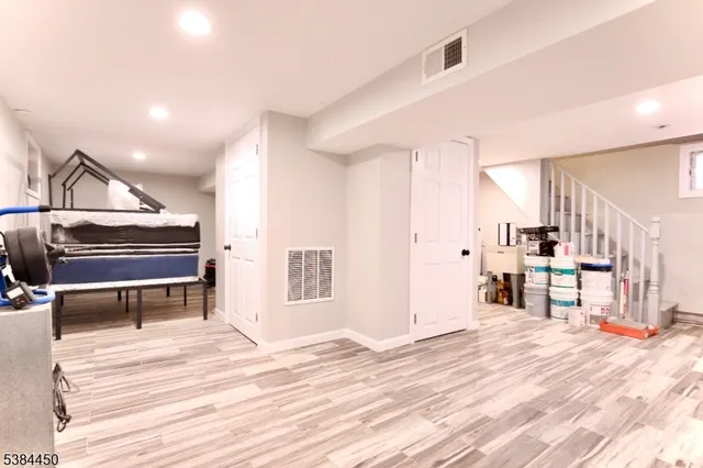 a view of a room with wooden floor and closet