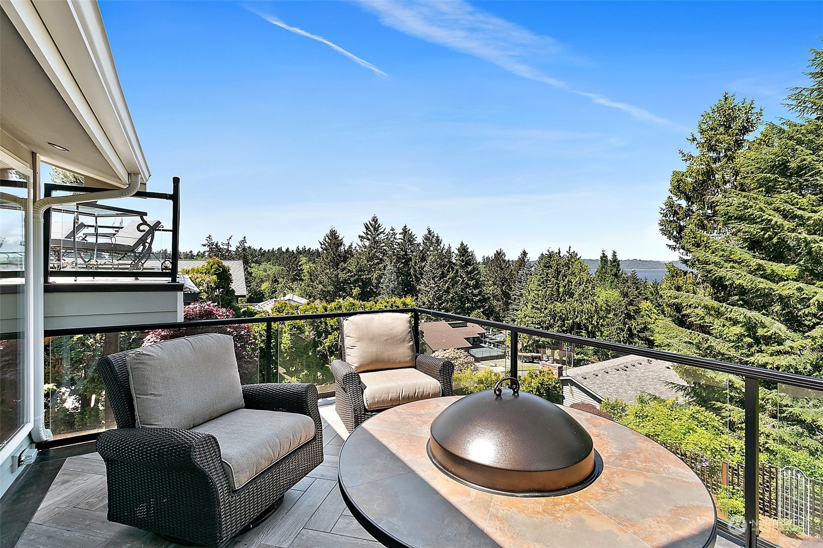 4152 Southwest 314th Street Federal Way, WA 98023 - Photo 31 of 36 a balcony with outdoor seating and green space