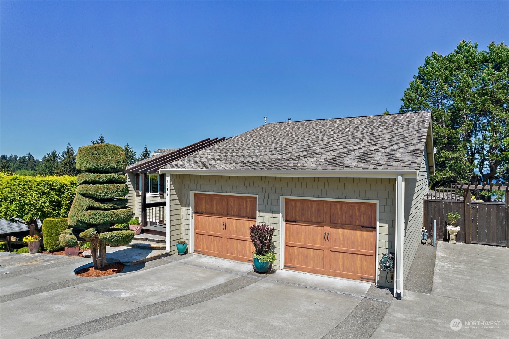 4152 Southwest 314th Street Federal Way, WA 98023 - Photo 34 of 36 a view of a house with a garage
