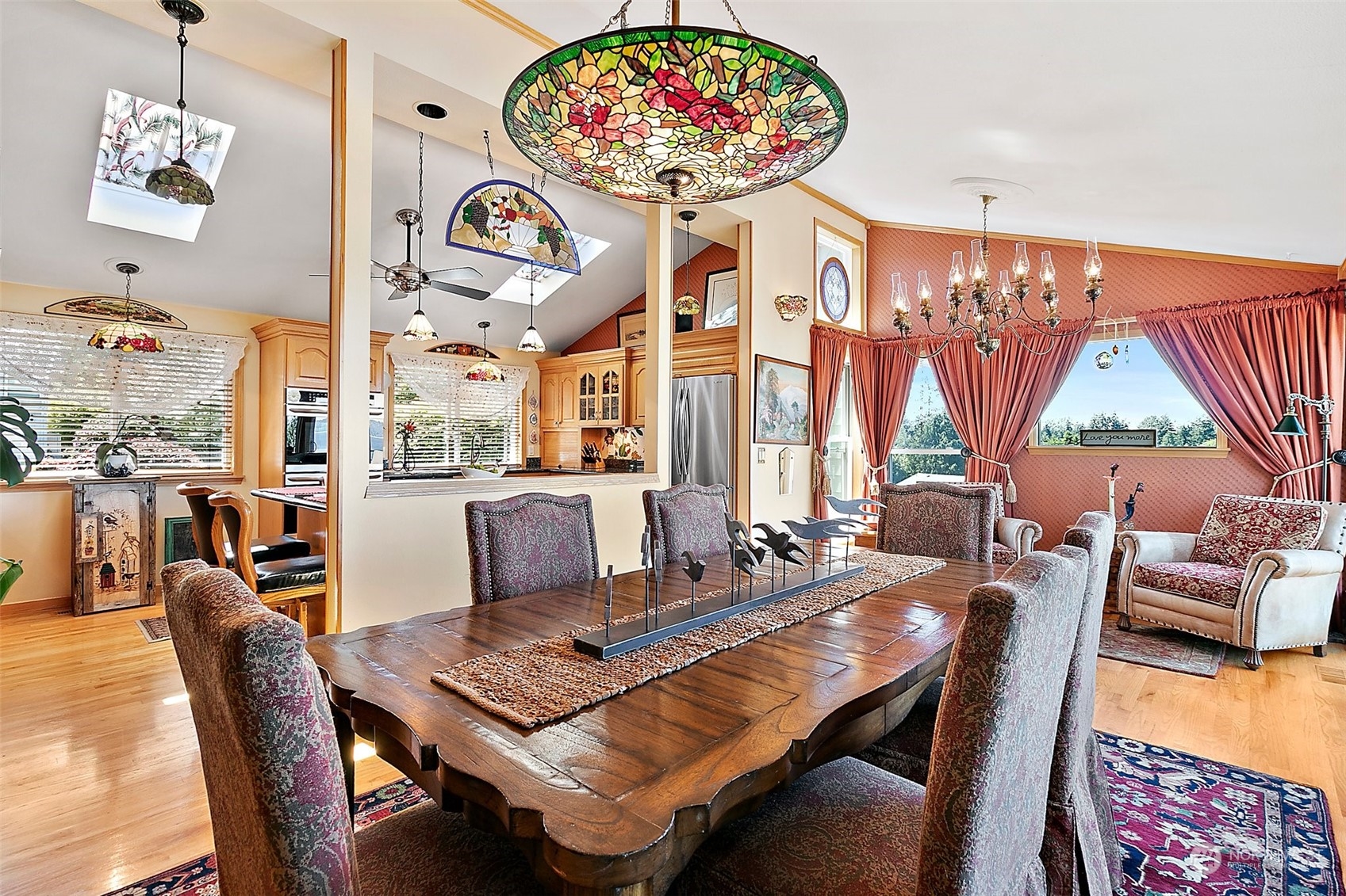 4152 Southwest 314th Street Federal Way, WA 98023 - Photo 4 of 36 a view of a dining room with furniture wooden floor and a chandelier