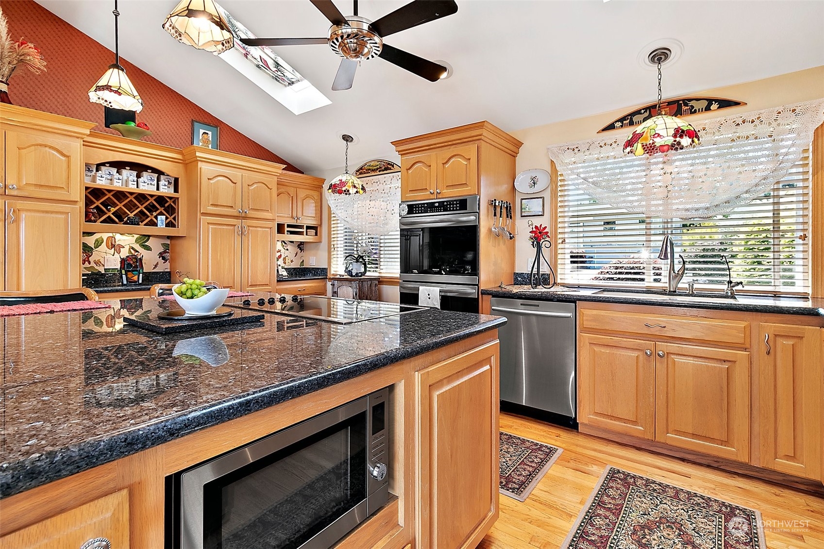 4152 Southwest 314th Street Federal Way, WA 98023 - Photo 5 of 36 a kitchen with stainless steel appliances granite countertop a sink and cabinets