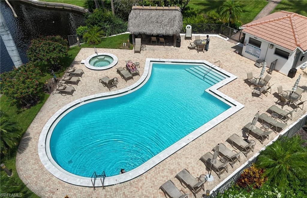 5890 Via Lugano, Unit 101 Naples, FL 34108 - Photo 19 of 22 an aerial view of a house with a swimming pool