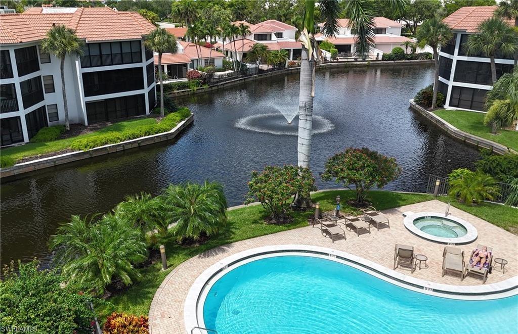 5890 Via Lugano, Unit 101 Naples, FL 34108 - Photo 20 of 22 an aerial view of a house with swimming pool and outdoor seating
