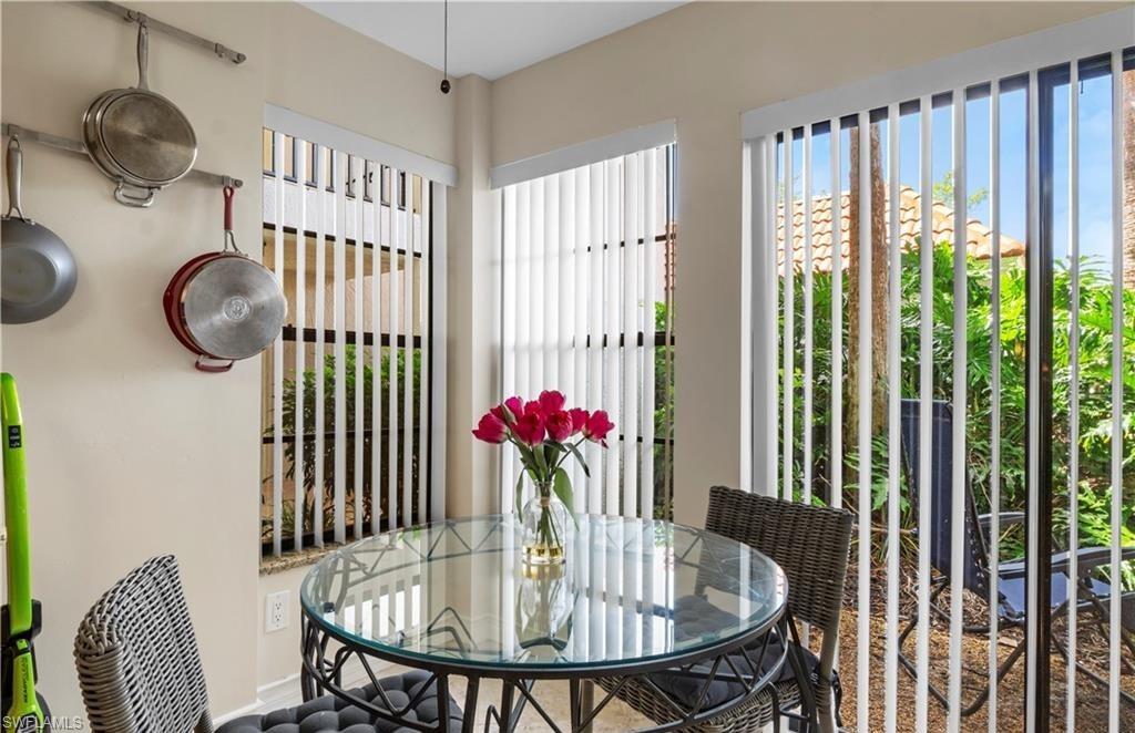 5890 Via Lugano, Unit 101 Naples, FL 34108 - Photo 6 of 22 a dining room with furniture and fan floor