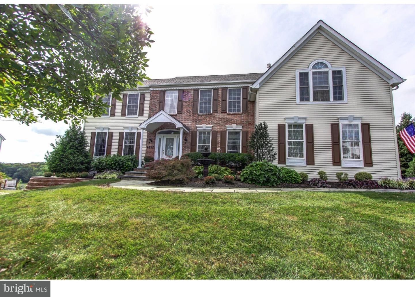 5237 Windtree Drive Doylestown, PA 18902 - Photo 1 of 25 a front view of a house with a yard